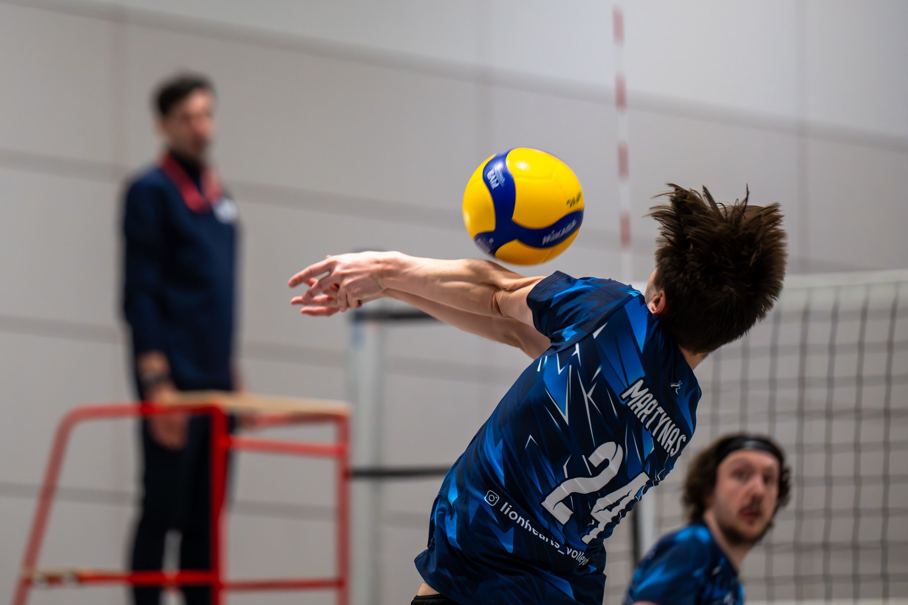 Lionhearts men’s player digging the ball during a match