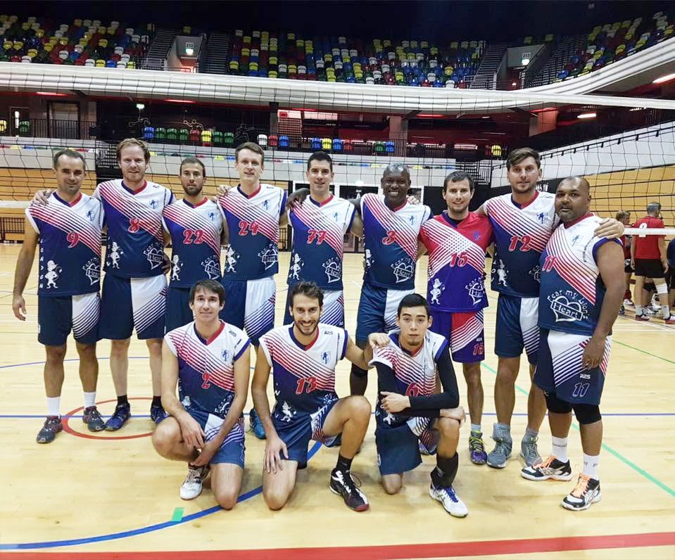 Lionhearts men's squad in navy and red kit, posed in front of the net on an arena court